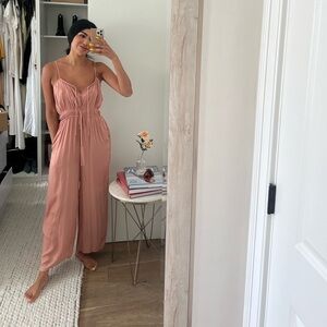 Pink satin jumpsuit with pockets. New with tags.